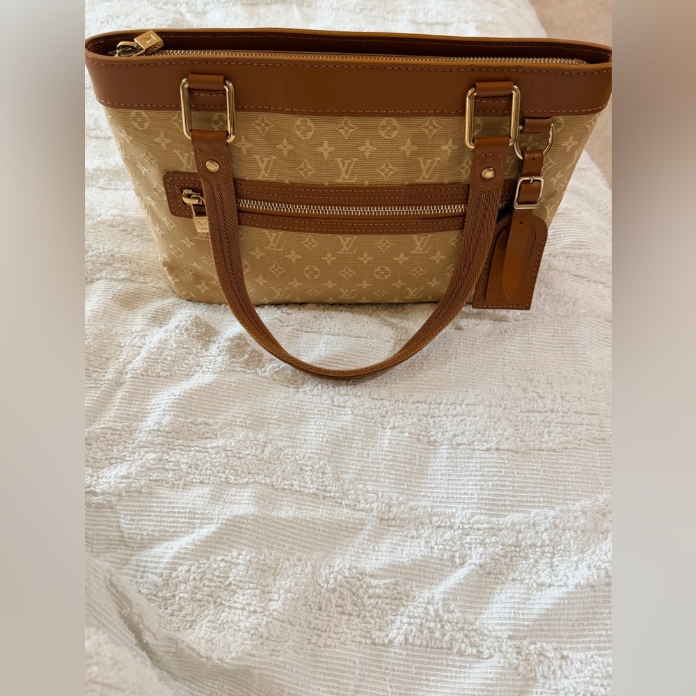 Authentic Louis Vuitton Lucille Cloth and leather handbag